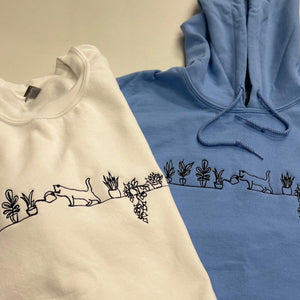 Embroidered Cat Watering Plants Sweatshirt white and carolina blue