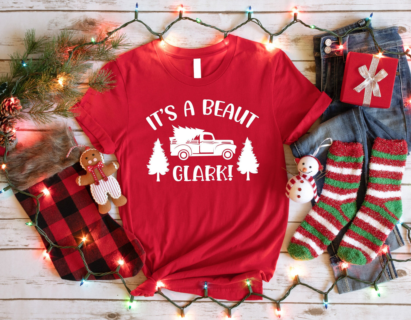 a t - shirt that says it&#39;s a beaut clark surrounded by christmas