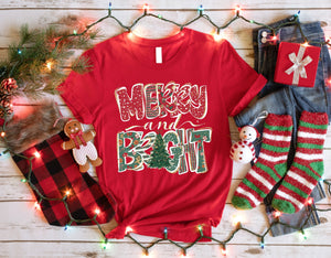 a t - shirt that says merry and bright surrounded by christmas decorations