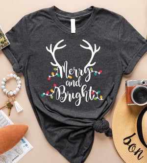 a t - shirt with the words merry and bright on it