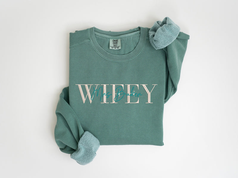 a green t - shirt with the word whey on it