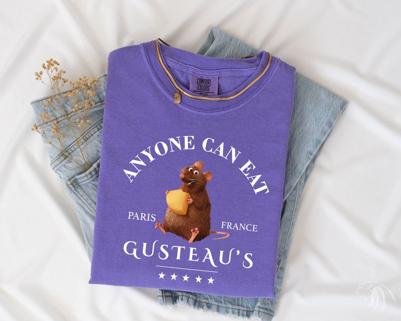 a purple t - shirt with an image of a mouse on it