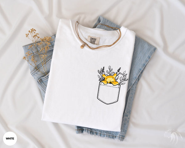 a t - shirt with a picture of a sunflower sticking out of the pocket