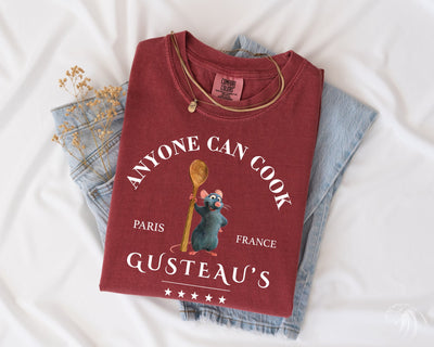 a t - shirt that says anyone can cook, paris, france, and a