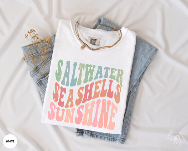 a t - shirt that says saltwater, seashells, and sunshine on